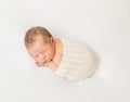 Adorable child napping covered with scarf Royalty Free Stock Photo