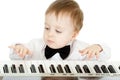 Adorable child playing electronic piano