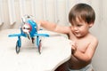 Adorable child playing with toy airplane Royalty Free Stock Photo