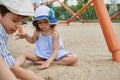 Adorable children, boy and girl, playing on the sandy playground on the beach. Childhood and summer holidays concepts. Summer camp Royalty Free Stock Photo