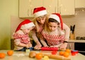 Adorable children and mother cooking Christmas cookies at home. Baking Royalty Free Stock Photo