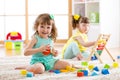 Adorable children playing colorful toys