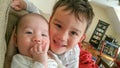 Adorable Chinese Caucasian Baby Boy Hugs His Baby Brother