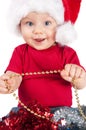 Adorable christmas child in a red hat