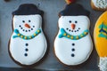 Adorable Christmas gingerbread cookies decorated to look like happy snowmen