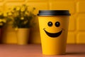 Adorable coffee cup persona on yellow backdrop, sporting a grin Copy friendly atmosphere Royalty Free Stock Photo