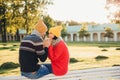 Adorable couple spend time together: attractive man hold his girlfriend`s hands, going to make her proposal, look with great love