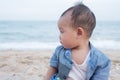 Adorable Cute  Asian baby boy playing with beach toys on tropical beach Royalty Free Stock Photo