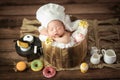 Adorable cute Asian newborn baby wearing chef hat sleeping Royalty Free Stock Photo