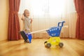 Adorable cute baby boy helper mopping room floor Royalty Free Stock Photo