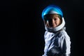 Adorable cute boy astronaut in outer space. Child imagines himself to be an astronaut in an astronauts helmet. Success