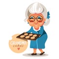 Grandmother grandma in a blue dress and glasses with cooked, fresh baked cookies