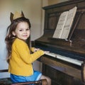 Adorable Cute Girl Playing Piano Concept Royalty Free Stock Photo