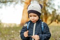 Adorable cute little boy blowing on a dandelion flower on the nature Royalty Free Stock Photo