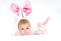 Adorable cute newborn baby girl in Easter bunny costume and ears. Royalty Free Stock Photo