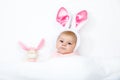 Adorable cute newborn baby girl in Easter bunny costume and ears. Royalty Free Stock Photo