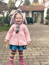 Adorable cute toddler girl walking in a park on autumn day. Happy child having fun outdoors. Autumnal activities with Royalty Free Stock Photo