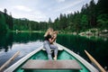 Hipster travel woman with best friend pet on boat Royalty Free Stock Photo