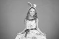 Adorable cutie. Easter bunny is symbol of Easter. Small girl in bunny headband for Easter celebration. Little girl