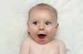 Adorable excited smiling baby open mouth laughing Royalty Free Stock Photo
