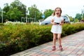 Adorable expressive little girl with a smartphone Royalty Free Stock Photo