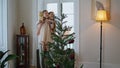 Adorable family preparing xmas house closeup. Girl putting Christmas star tree