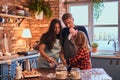 Family together cooking breakfast in loft style kitchen. Royalty Free Stock Photo