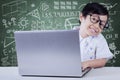 Adorable female student with laptop