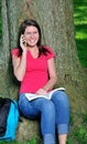 Adorable female student - talking on cell phone Royalty Free Stock Photo