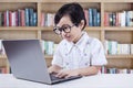 Adorable Female Student using Laptop