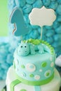 Adorable first birthday cake with dragon. Royalty Free Stock Photo