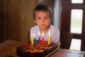 Adorable five year old boy celebrating