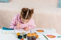 adorable focused child sitting and