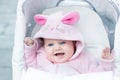 Adorable funny baby girl wearing pink bunny suit