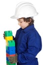 Adorable future builder constructing a brick wall with toy piece Royalty Free Stock Photo