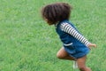 Adorable girl with Afro hair run with fun in park, healthy mix race toddler play in green garden enjoy running happy, young kid pr Royalty Free Stock Photo