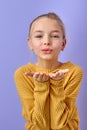 adorable girl blowing a kiss. pretty young child sending love. romance and warm feelings Royalty Free Stock Photo