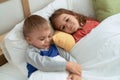 Adorable girl and boy smiling confident lying on bed at bedroom Royalty Free Stock Photo