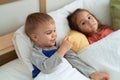 Adorable girl and boy smiling confident lying on bed at bedroom Royalty Free Stock Photo