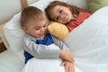 Adorable girl and boy smiling confident lying on bed at bedroom Royalty Free Stock Photo