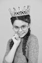 Adorable girl in glasses. Happy smiling princess. Excellent pupil. Success and happiness. Smartest princess. Intelligent