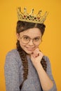 Adorable girl in glasses. Happy smiling princess. Excellent pupil. Success and happiness. Smartest princess. Intelligent
