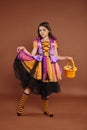 adorable girl in Halloween costume holding Royalty Free Stock Photo