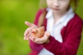 Adorable girl holding clay whistle