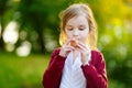 Adorable girl holding clay whistle Royalty Free Stock Photo