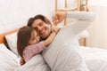Adorable girl hugging her happy father after waking up Royalty Free Stock Photo