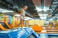 Adorable girl jumping on kids trampoline Royalty Free Stock Photo