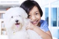 Adorable girl and maltese dog Royalty Free Stock Photo