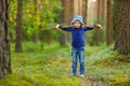 Adorable girl picking foxberries in the forest Royalty Free Stock Photo