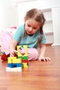 Adorable girl playing with blocks